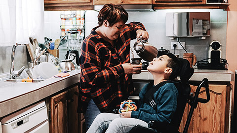 A mother taking care of a disabled child