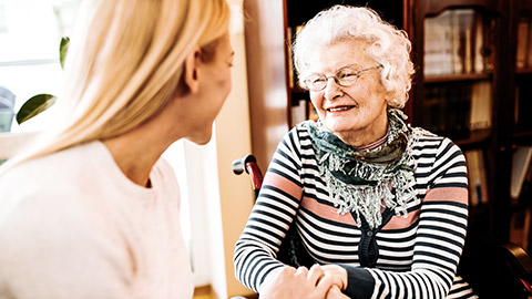 Elder woman talking with a young woman