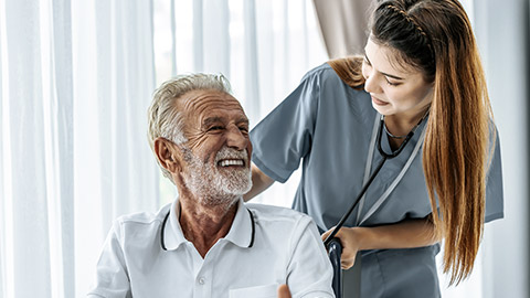 Elder man talking with nurse