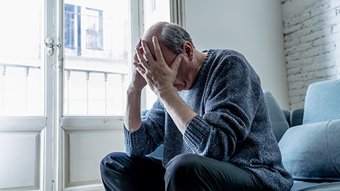 overwhelmed man suffering alone