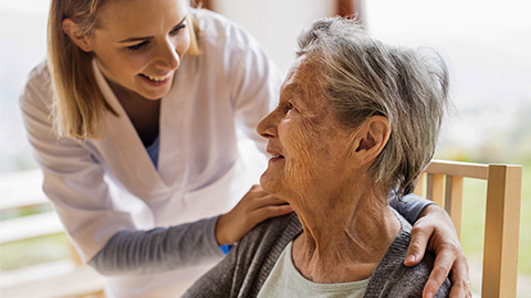 a woman taking care of a senior