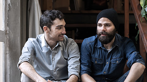 Two men talking on the stairs