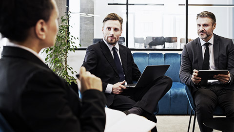 People in suits discussing the legal frame works in health and safety