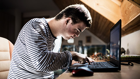 A person with special needs learning to use a computer