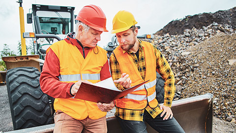 Two coworkers on site having a serious discussion about a previous incident