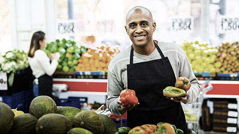 A person in a fruit stand