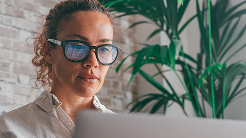 A close view of an accountant working on a laptop