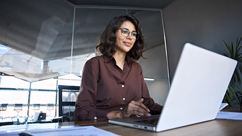 An accountant working on a laptop