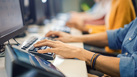 A close view of a person typing on a keyboard