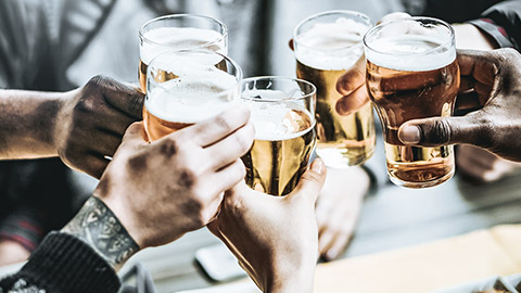 Toasting glasses of beer