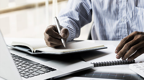 A person researching on a laptop