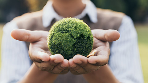 Asian teenager showing earth on hand, ecology and environment sustainable concept