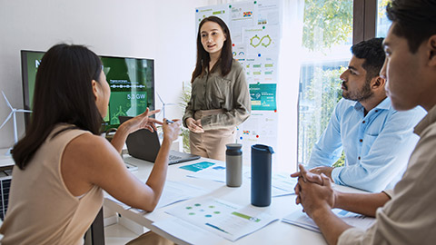 woman lead young group of multiethnic businesspeople in team meeting