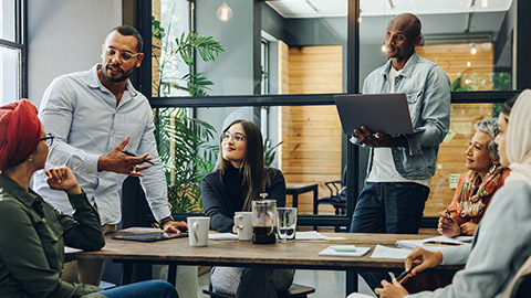 Creative business professionals having a group discussion during a meeting in a modern office