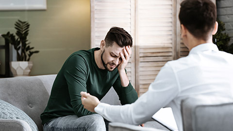 male psychologist with client