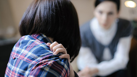 An abused person talking to a counsellor