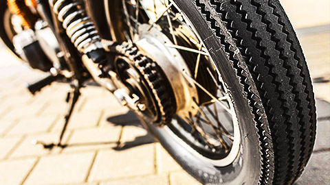 a close up shot of a motor cycle's rear tyre