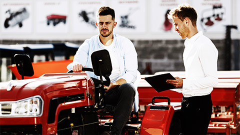 a person purchasing a farming equipment