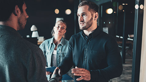 A manager talking to a colleague about a concern