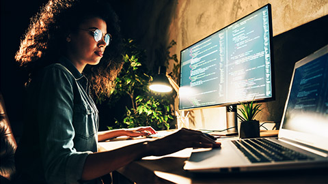 skilled web expert sitting using computer