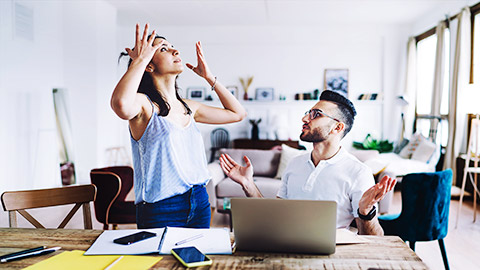 two colleagues having pretty heated discussion at modern workplace