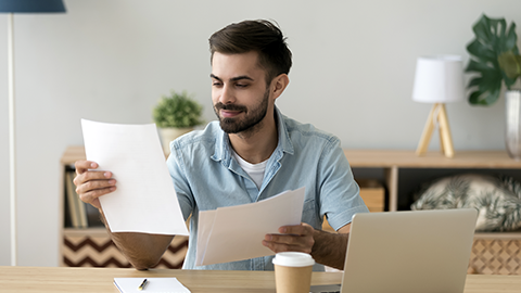 man holding paper reviewing