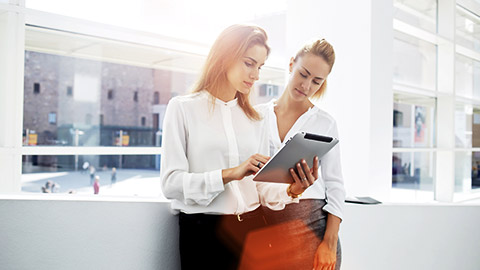 business women checking tablet