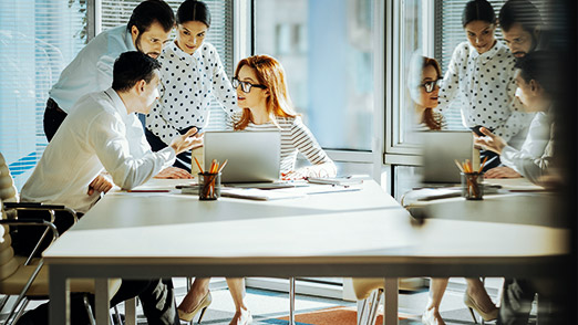 a group of employees getting feedback