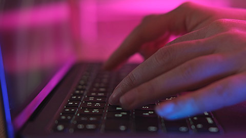 A close view of a person typing on a keyboard