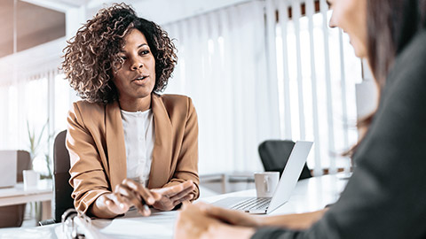 Woman discussion over a legal paper