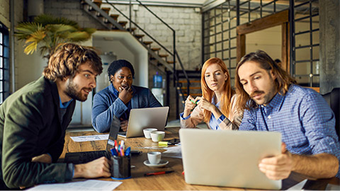 Young business partners having meeting in office