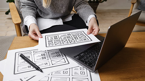 Woman designer create website design wireframe.