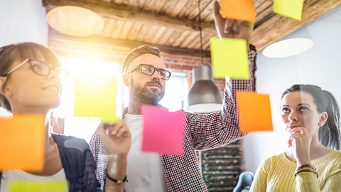 Business people meeting at office and use post it notes to share idea