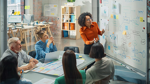 Black Businesswoman Leads Business Meeting with Managers