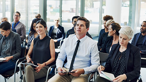 Shot of a group of businesspeople attending a conference