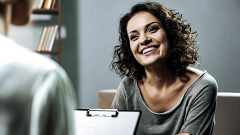 Happy woman talking to an interviewer