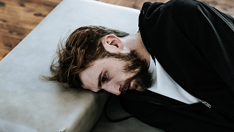 Man lying on sofa