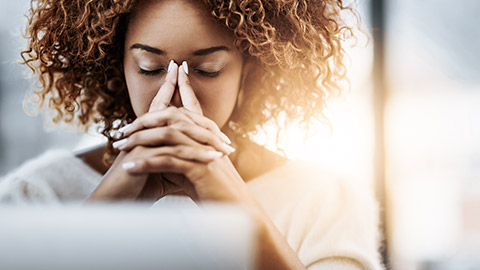 Woman eyes closed, contemplating