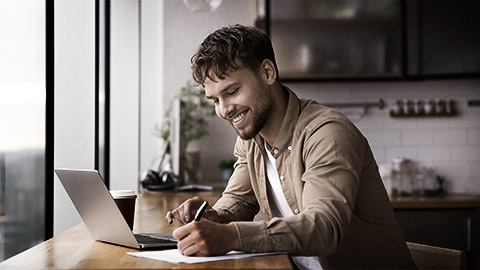 A person writing down goals