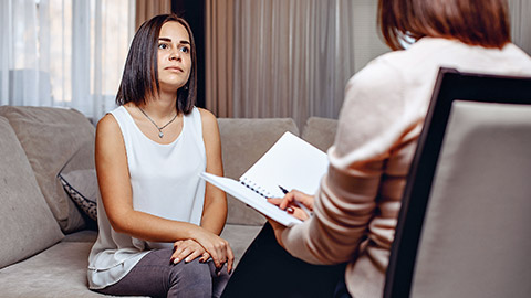 Beautiful worried woman at a psychologist appointment