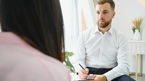 session with psychotherapist, woman with depression solves mental difficulties and talks about problems to male psychologist