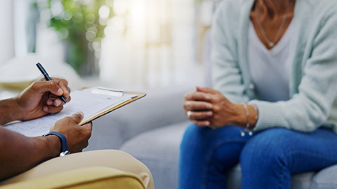 Woman, hands or consulting a therapist writing on clipboard notes for healthcare service of cancer therapy