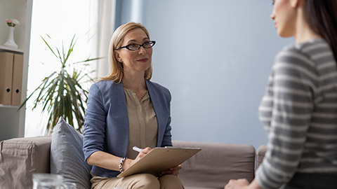 a woman having a consultation session with a young lady