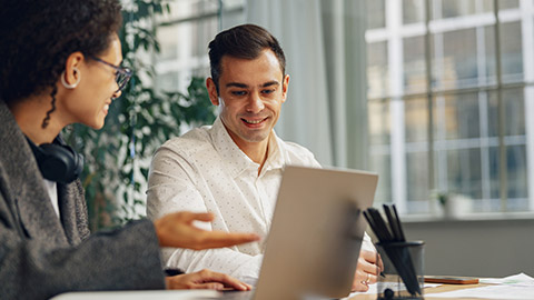 colanalysing new financial project while working together on office desk