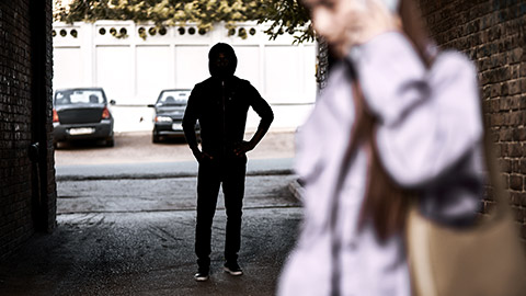 Woman being followed talking to a phone