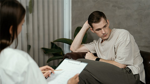 Stressed and depressed patient seeking help from psychiatrist