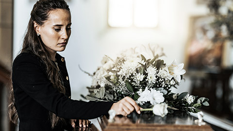 woman grieving at a funeral