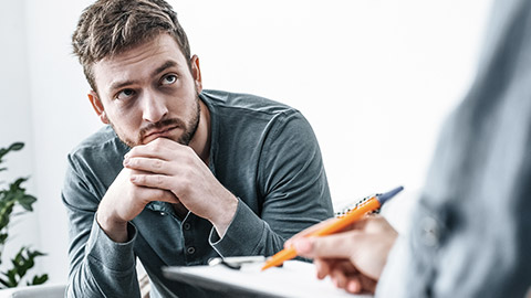 man looking at interviewer