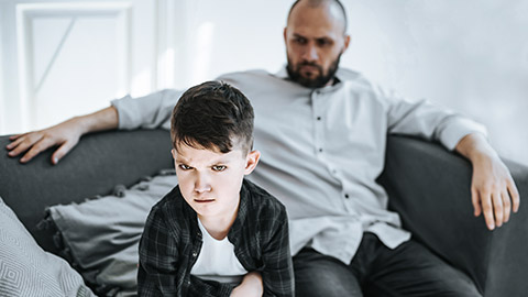 Boy angry with father