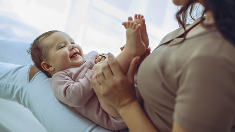 mother is holding her newborn baby